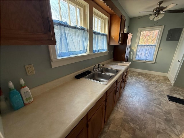 kitchen with ceiling fan and sink