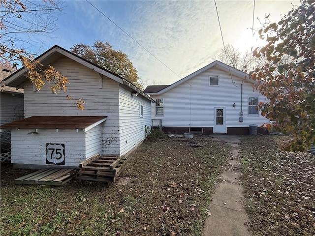 back of property featuring central air condition unit