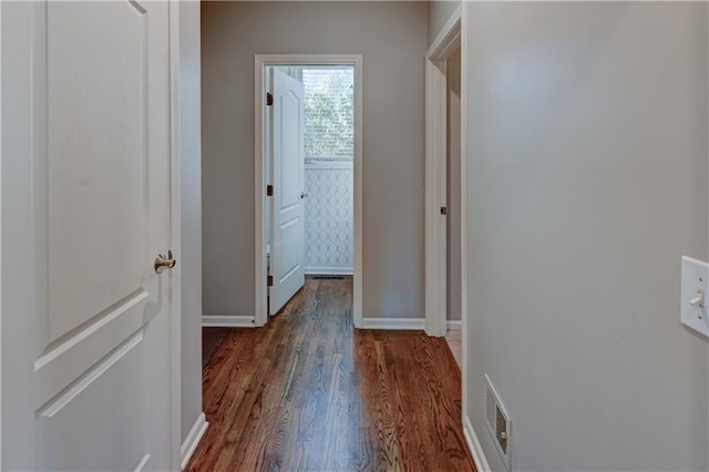 corridor featuring dark wood-type flooring