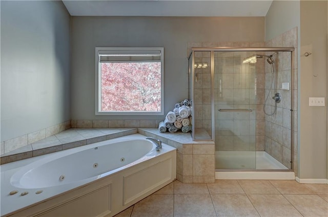 bathroom featuring tile patterned flooring and shower with separate bathtub