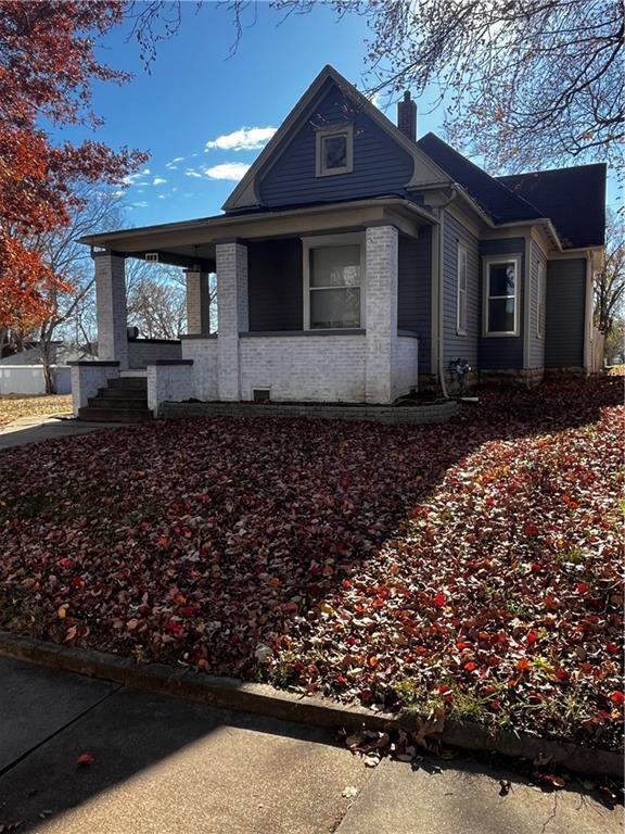 view of property exterior with a porch