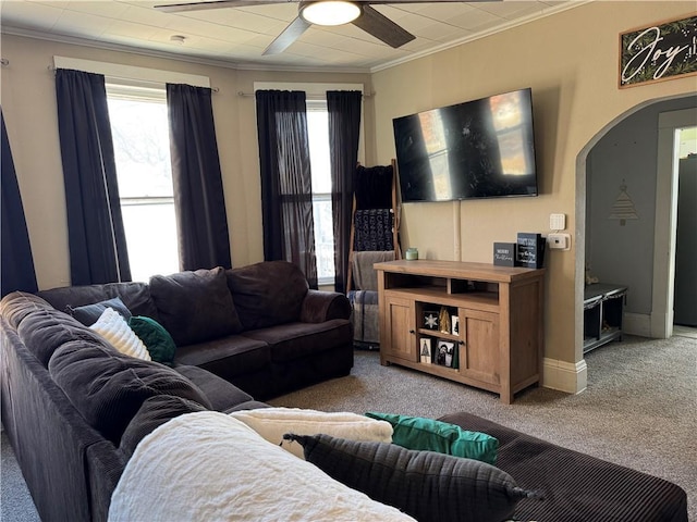 living room with light colored carpet, ceiling fan, and ornamental molding