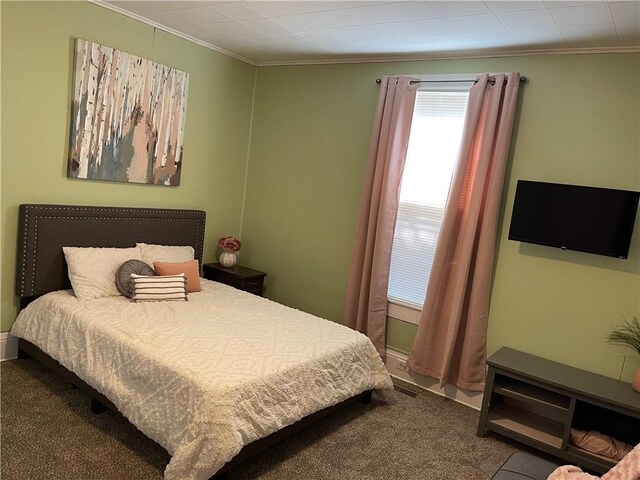 bedroom with carpet flooring and ornamental molding