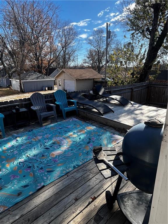 wooden deck featuring an outbuilding