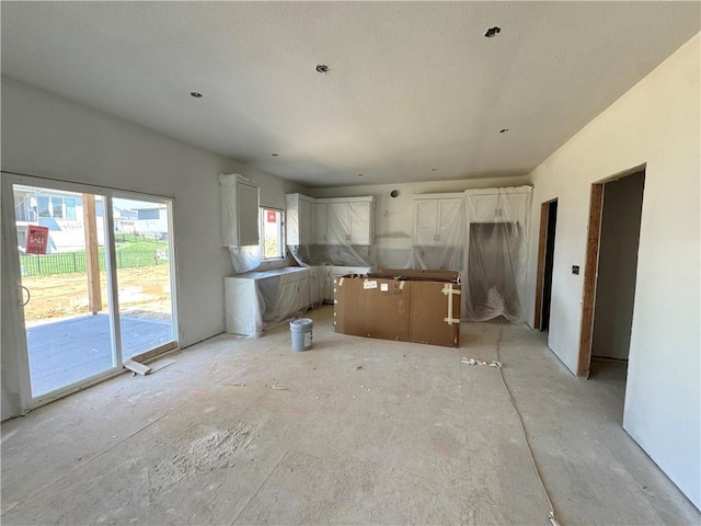 kitchen featuring a center island and white cabinetry