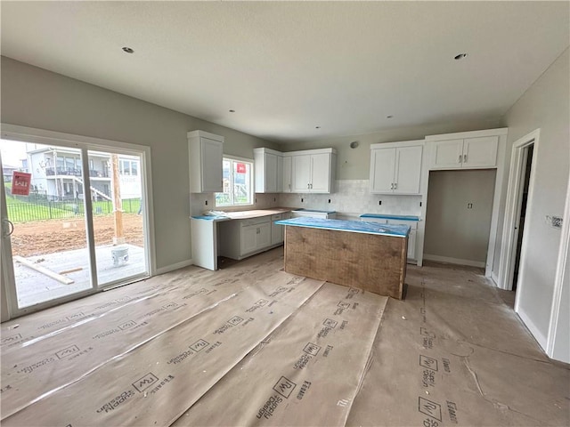 13408 W 178th St, Overland Park, KS 66013 - kitchen with a center island, white cabinets, and baseboards