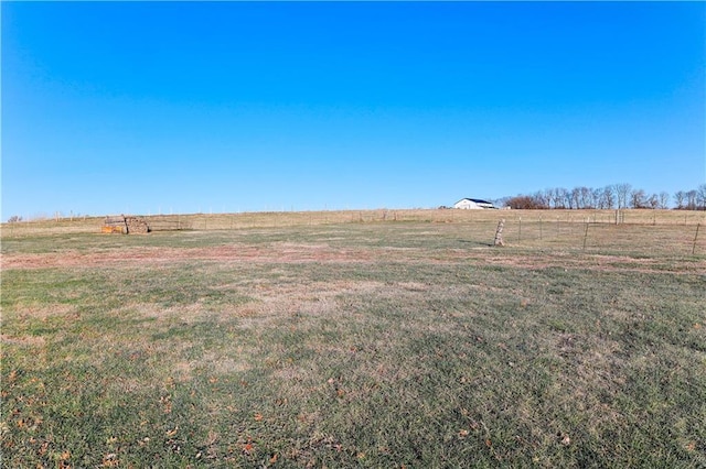 view of yard with a rural view