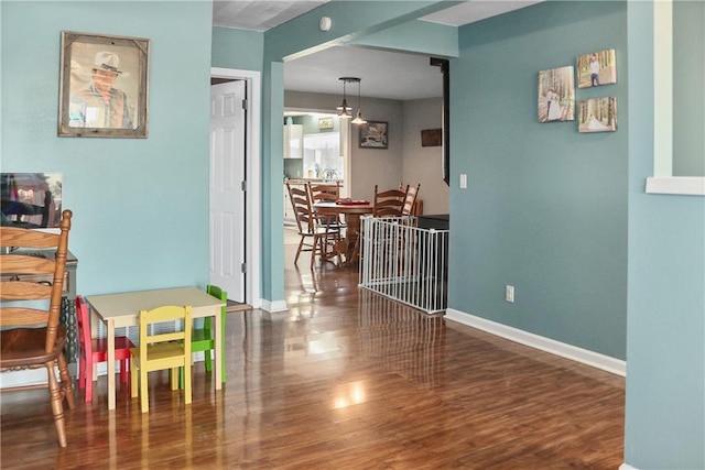 hallway featuring dark hardwood / wood-style flooring