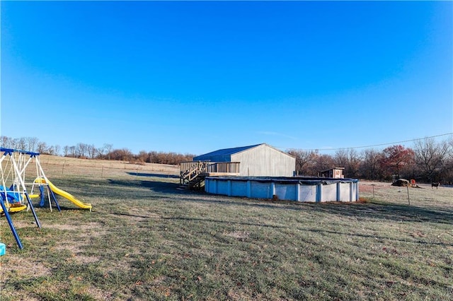 view of yard with a rural view