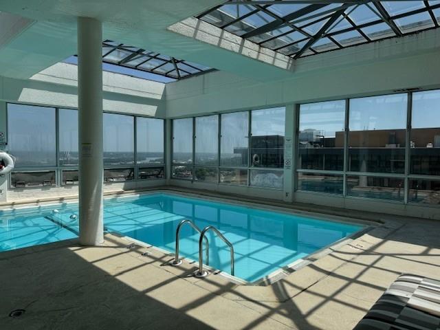 view of pool with a lanai and a patio area