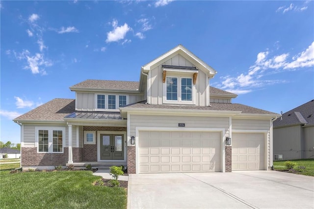 view of front of house featuring a garage and a front yard