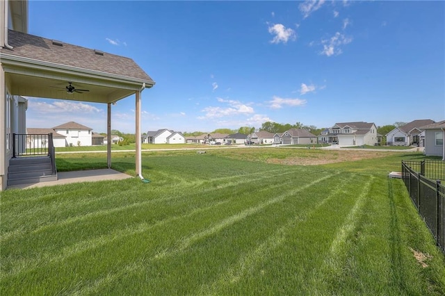 view of yard featuring ceiling fan