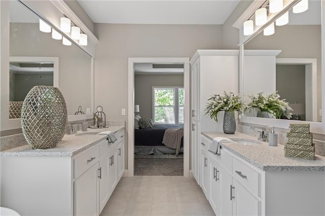 bathroom with tile patterned flooring and vanity