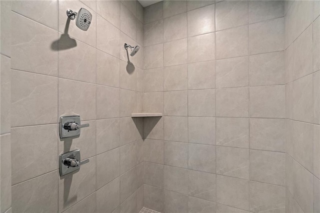 interior details with a tile shower