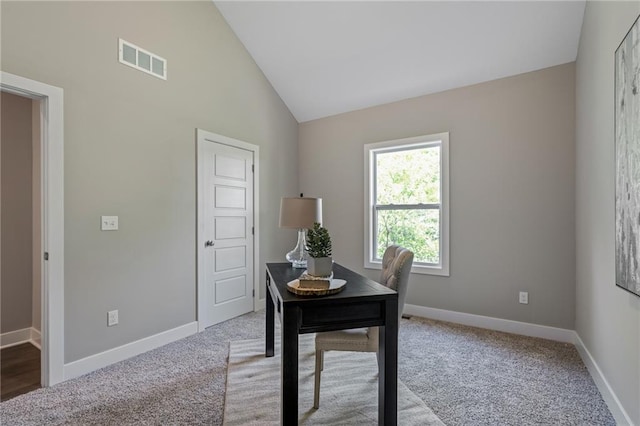 carpeted office featuring high vaulted ceiling