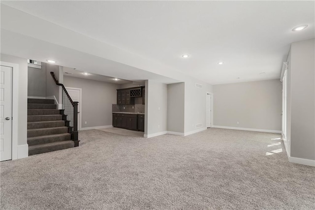 unfurnished living room with carpet