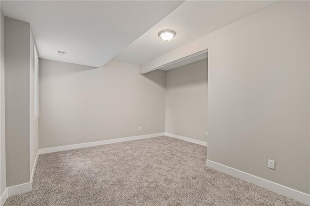 basement with light colored carpet