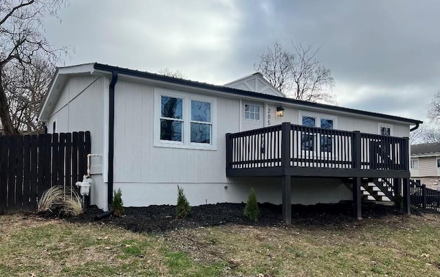 back of property with a wooden deck