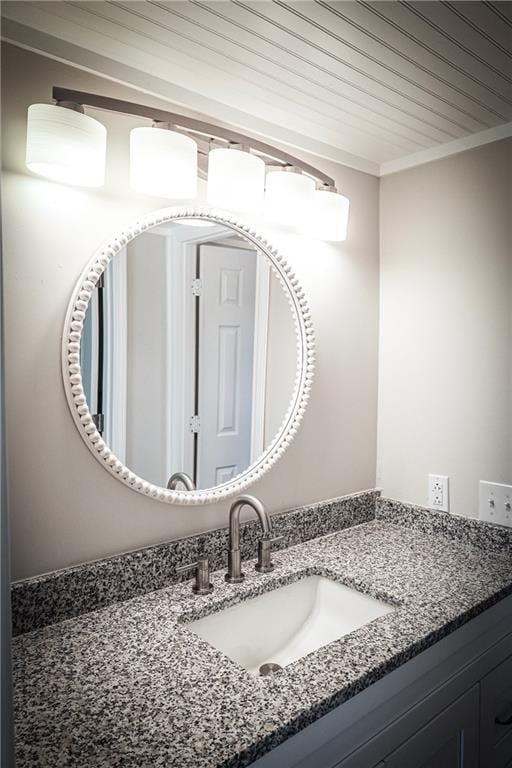 bathroom featuring vanity and wood ceiling