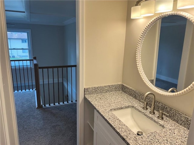 bathroom with vanity and crown molding