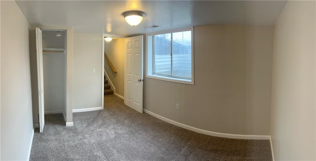 unfurnished bedroom with carpet flooring and a closet