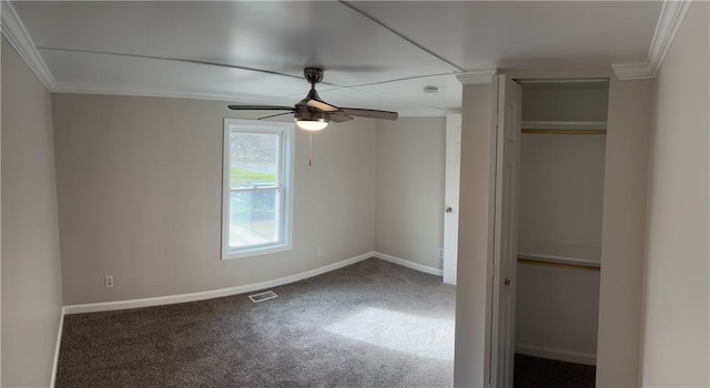 unfurnished bedroom with carpet flooring, ceiling fan, ornamental molding, and a closet