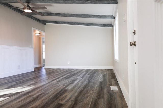 unfurnished room with vaulted ceiling with beams, ceiling fan, and dark hardwood / wood-style flooring