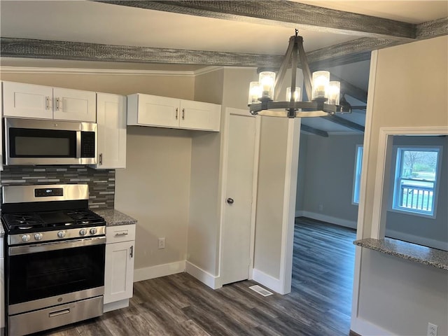 kitchen with backsplash, stainless steel appliances, an inviting chandelier, white cabinets, and dark hardwood / wood-style floors