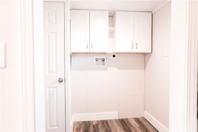 washroom with electric dryer hookup, cabinets, dark hardwood / wood-style flooring, and washer hookup