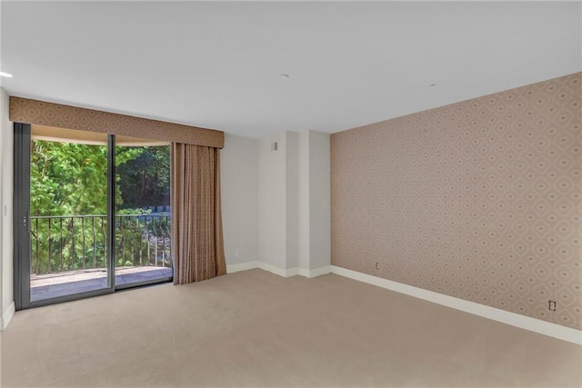 433 Ward Pkwy Unit 3S, Kansas City, MO 64112 - empty room featuring carpet and wallpapered walls