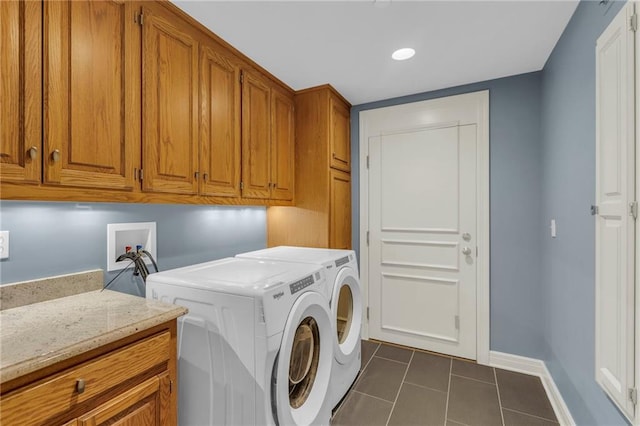 433 Ward Pkwy Unit 3S, Kansas City, MO 64112 - laundry area with cabinet space, dark tile patterned floors, washer and clothes dryer, and recessed lighting