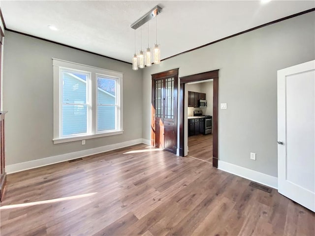 unfurnished dining area featuring a notable chandelier and dark hardwood / wood-style floors