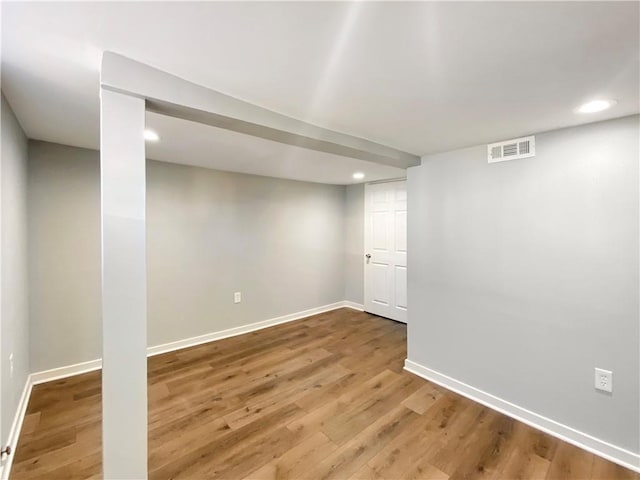 basement featuring wood-type flooring