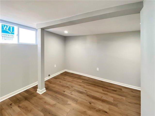 basement featuring hardwood / wood-style floors