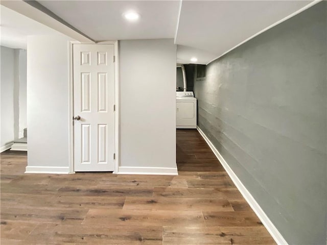 interior space with washer / clothes dryer and dark hardwood / wood-style floors