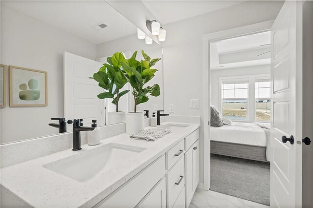 19704 W 195th Pl, Spring Hill, KS 66083 - bathroom with double vanity, ensuite bathroom, and marble look tile flooring