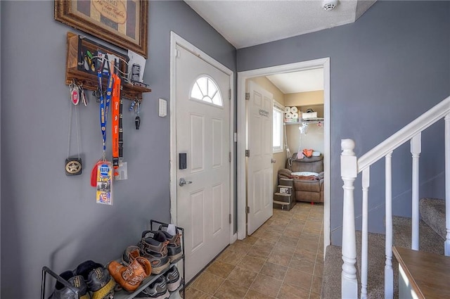 foyer entrance featuring stairs