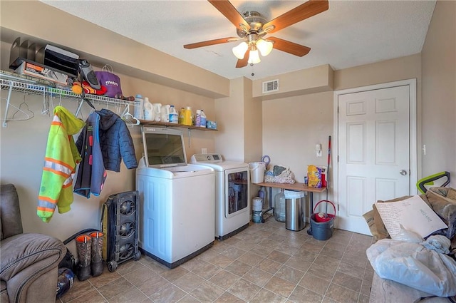 laundry room with laundry area, washing machine and dryer, a ceiling fan, and visible vents