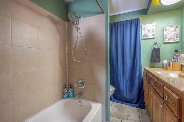 bathroom with tile patterned floors, toilet, vanity, and shower / bath combo