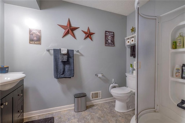 bathroom featuring visible vents, baseboards, toilet, vanity, and a textured ceiling