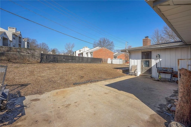 view of yard featuring a patio and fence