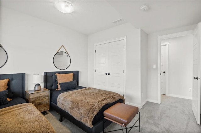 carpeted bedroom featuring a closet