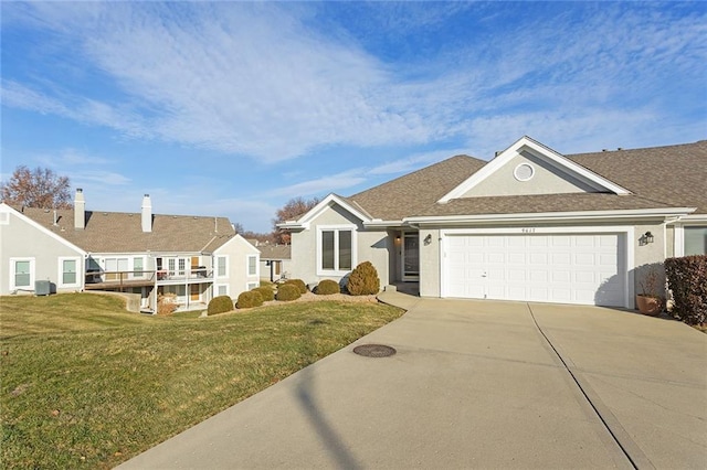 ranch-style house featuring central AC, a front lawn, and a garage