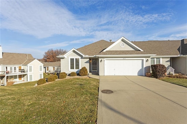 ranch-style house with a front yard and a garage