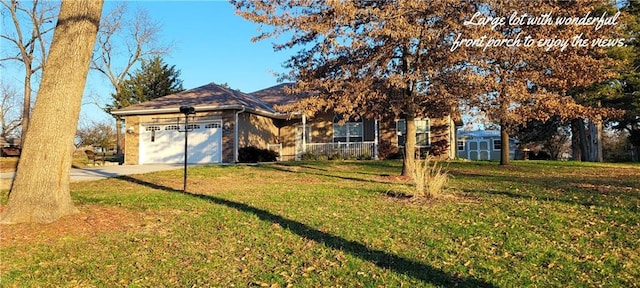 view of front of home featuring a garage and a front lawn