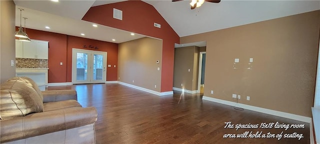 unfurnished living room with ceiling fan, dark hardwood / wood-style flooring, and high vaulted ceiling