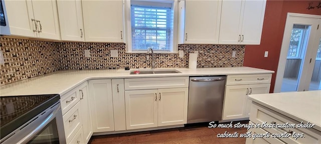 kitchen featuring backsplash, stainless steel dishwasher, dark wood-type flooring, sink, and white cabinetry