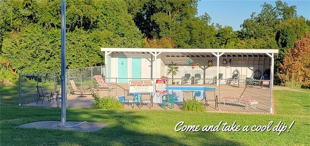 view of swimming pool with a yard and a patio area