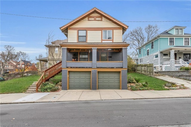 view of front facade with a porch and a garage