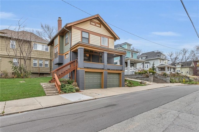 view of front of house with a garage and a front lawn